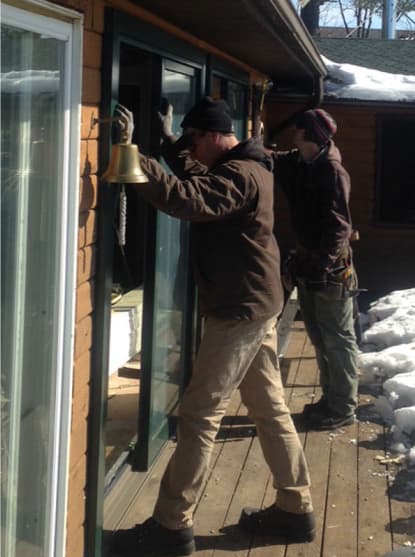 Workers installing a large window