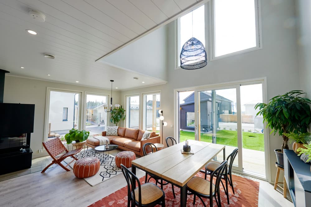Bright open-plan living space with dining area and garden access